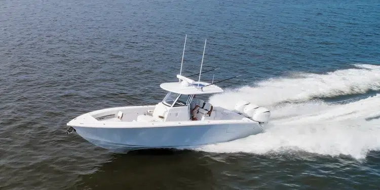 Jupiter 340LS cutting across deep blue open waters