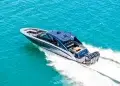 Mystic Powerboat 5200 XL Cabin running across bahamian blue waters