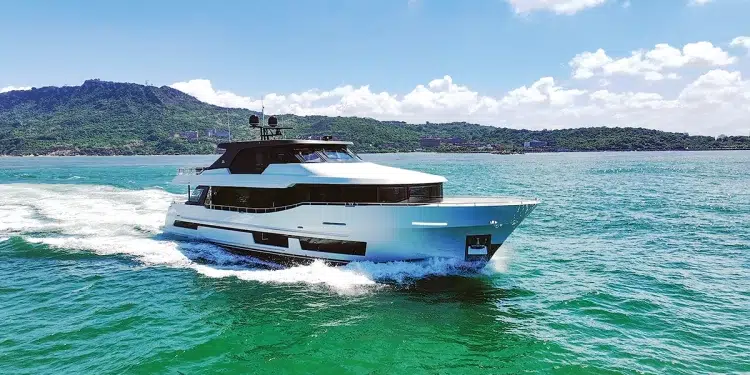The Ocean Alexander 28L running in open water with an island backdrop