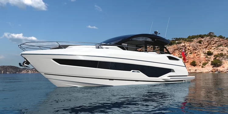 The Sunseeker Predator 55 anchored by an island