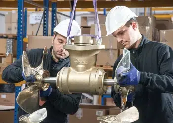 Top Tech For Cruising- Men Installing a Thruster