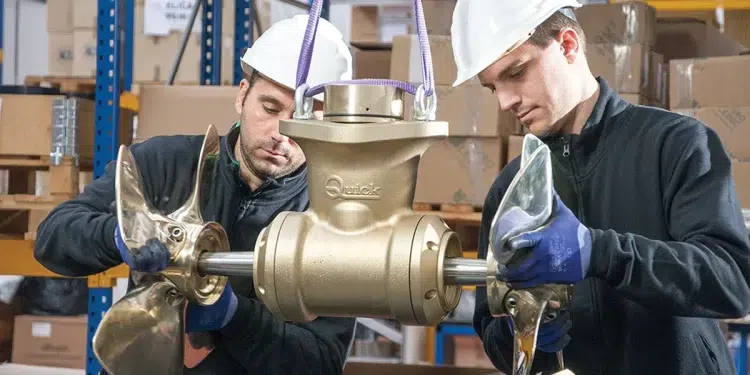 Top Tech For Cruising- Men Installing a Thruster