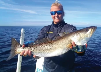 Winter Fishing Tips: An angler holding their catch