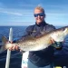 Winter Fishing Tips: An angler holding their catch
