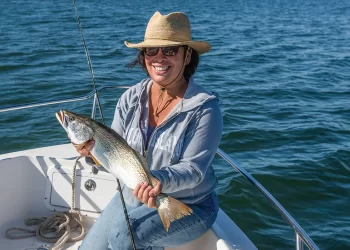 Fish data tracking - an angler poses with a large catch