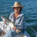 Fish data tracking - an angler poses with a large catch