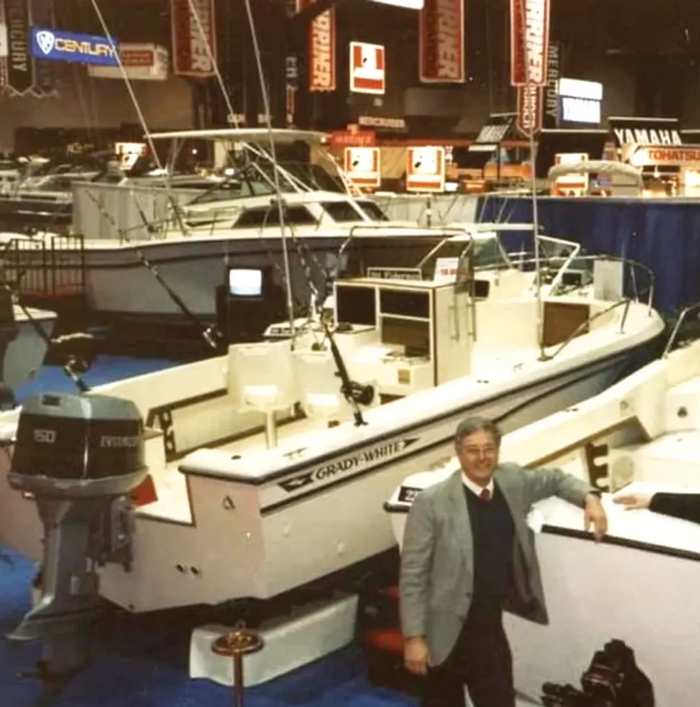 Bill Lieblein stands in front of Grady-White boats at the New York Boat Show in the 1980's