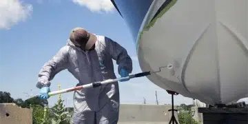 Spring boat prep time - a man washes his hull