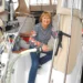 A woman pumps out her boat to prevent marine toilet smells