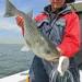 big bait big fish - a man holds his big catch