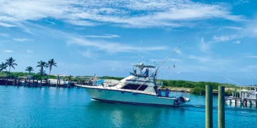 A refit Hatteras 41C exiting a dock