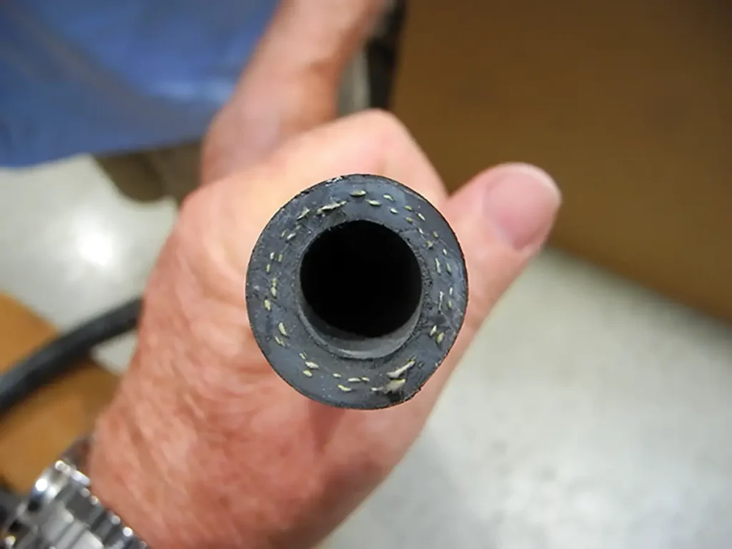 A man holds a clean Marine AC pipe