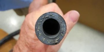 A man holds a clean Marine AC pipe