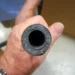 A man holds a clean Marine AC pipe