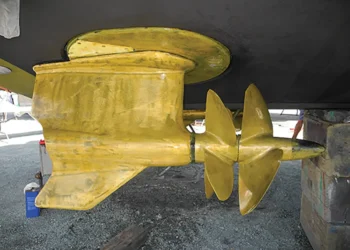 A golden propeller showing the end of this boat's steering system after a DIY project