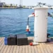 Shore power adapter on a dock with marina water as a backdrop