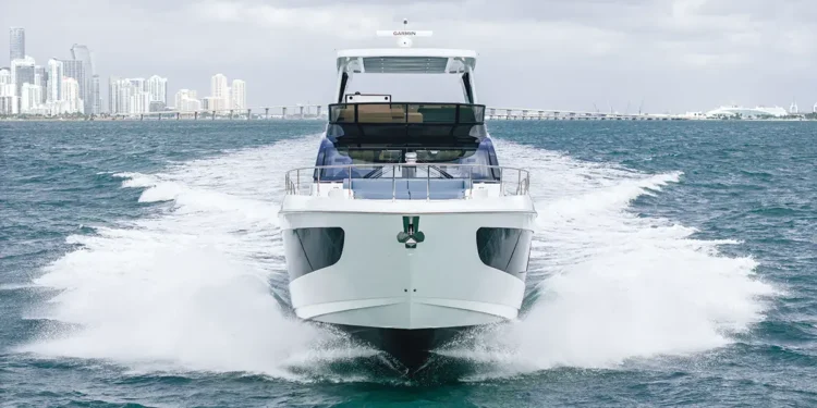 Front view of Cruisers Yachts' 57 FLY while running across water