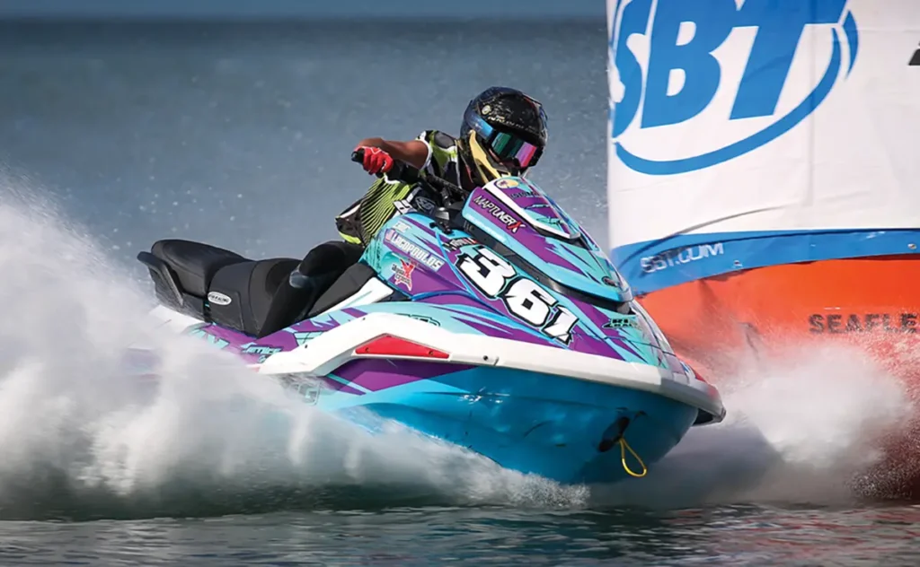A man on a jetski makes a tight turn