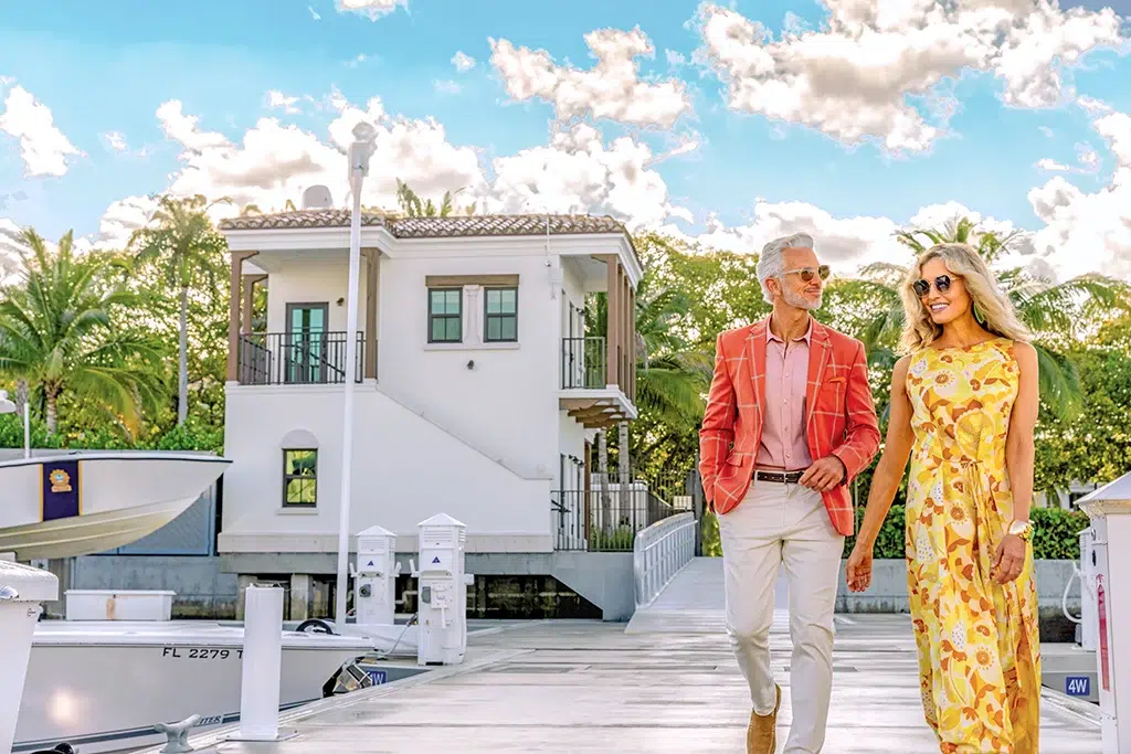 A couple walks the dock at the Town of Palm Beach Marina