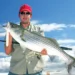 A man holding his catch after using surface lures