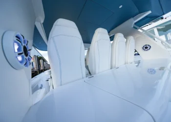 Kicker Marine Audio speaker system installed on a boat with white upholstery