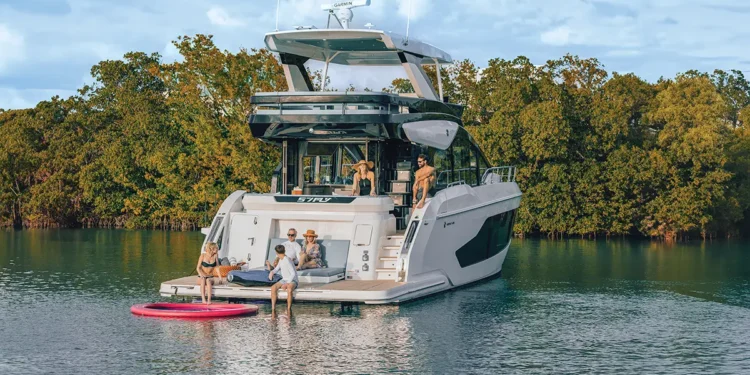 Cruisers FLY 57 idle in the water with a family on board