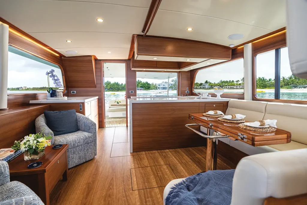 Matte teak interior salon and galley in Grand Banks 62