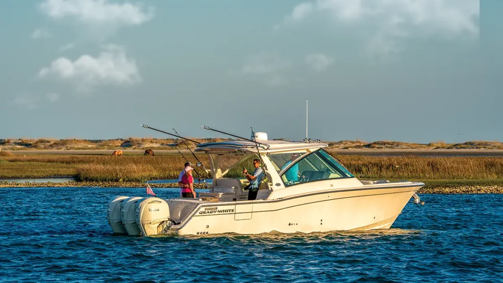 Grady-White Freedom 345 idle in the ocean with people on board