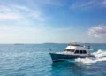 Grand Banks 62 yacht with traditional lines and dark hull running in the water