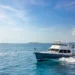 Grand Banks 62 yacht with traditional lines and dark hull running in the water