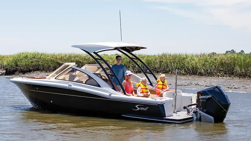 Scout 240 in the water with a family on board.