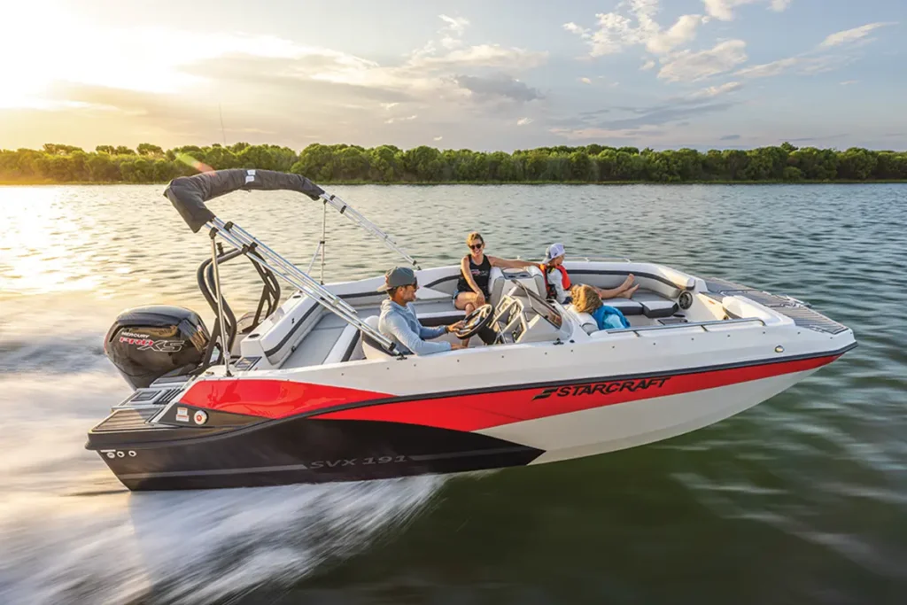 Starcraft boat with red stripe on white hull running in the water