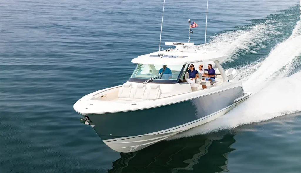 Tiara 43 LS running in the ocean with four people on board.