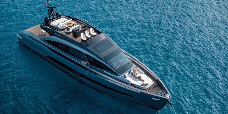 Pershing GTX-80 anchored in blue waters aerial view