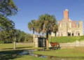 A horse stands infront of a historic building along Georgia's coastal waterways