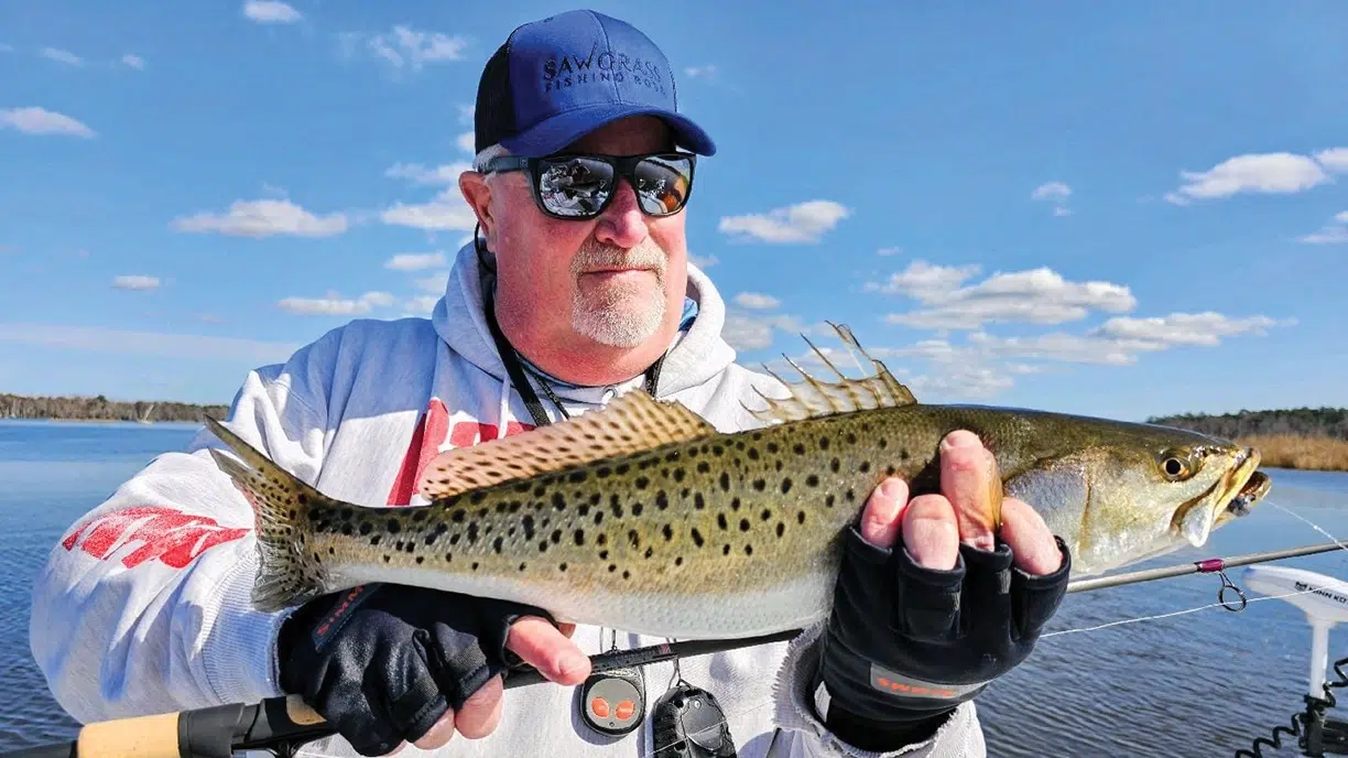 Capt. Gary Dubiel hoists a speck caught on light spinning gear