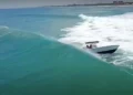 Boat capsizes in waves at Boynton Inlet
