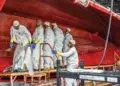 Pursuit Boats factory workers standing inside hull