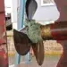 Rope wrapped tight around a boat propeller shaft and running gear