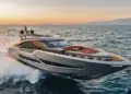 AB Yachts AB 80 running at speed at sunset, throwing a white waterjet wake