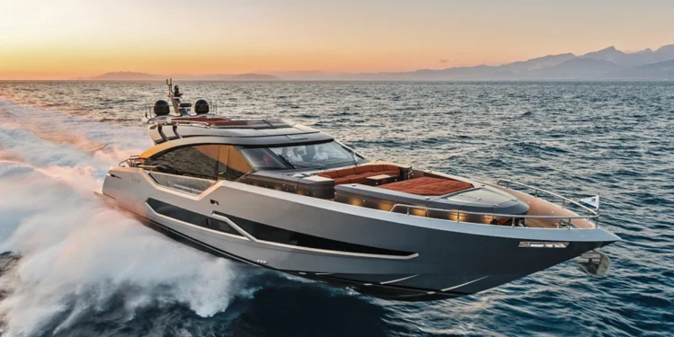 AB Yachts AB 80 running at speed at sunset, throwing a white waterjet wake