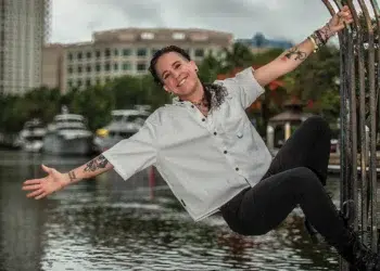 Private yacht chef Robyn Almodovar in chef’s whites at a waterfront gate