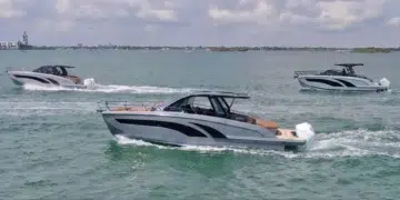 Three Hanover Yachts models running on the water with skyline behind