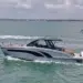Three Hanover Yachts models running on the water with skyline behind