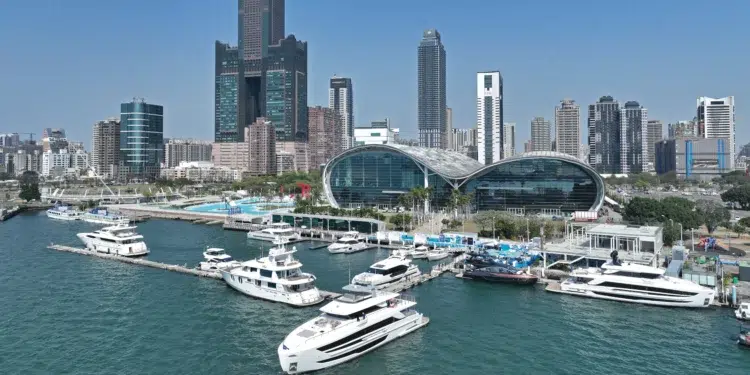 Horizon yachts berthed at Horizon City Marina below the Kaohsiung skyline in Taiwan