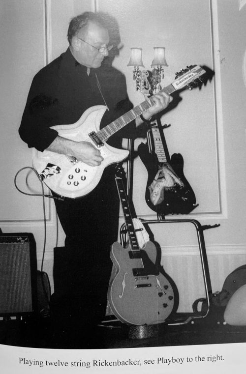 DOUGLAS J. CLARK with his guitar collection