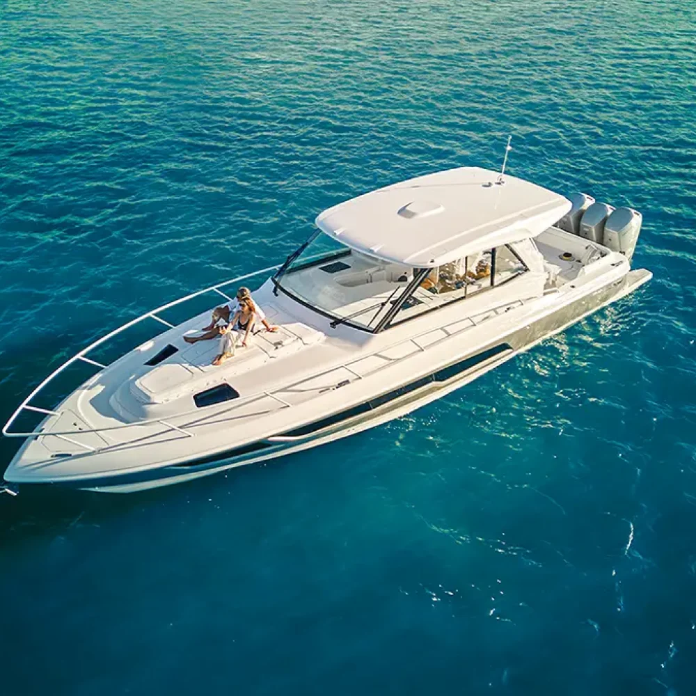 Intrepid 50 Evolution white boat with high gunwales idle in the water