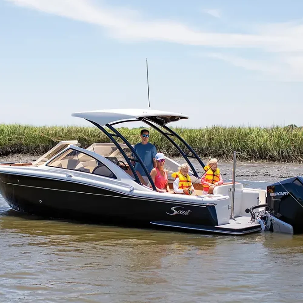 Scout 240 in the water with a family on board.